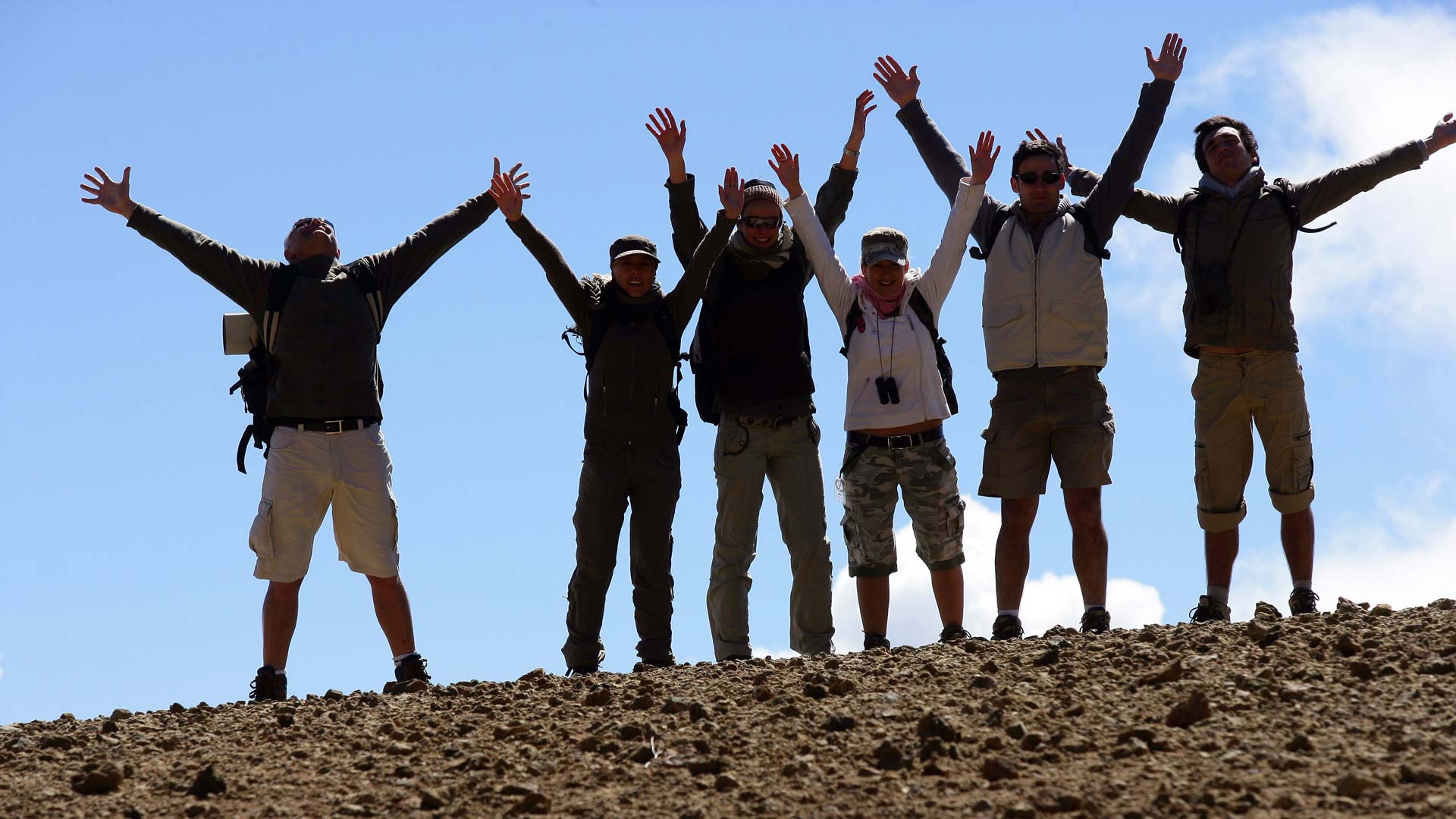 Hikers raising arms
