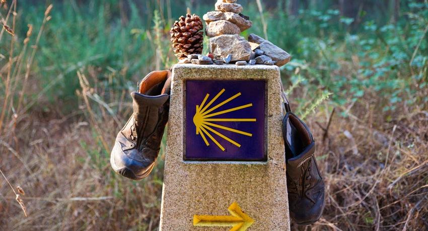 Mile marker with hiking boots