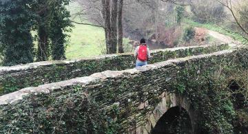 pilgrim on bridge near sarria