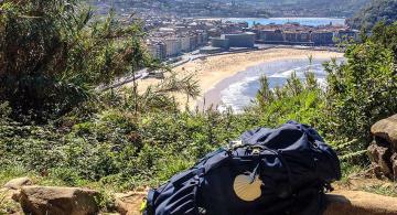 backpack on ledge overlooking playa de la Concha in San Sebastian