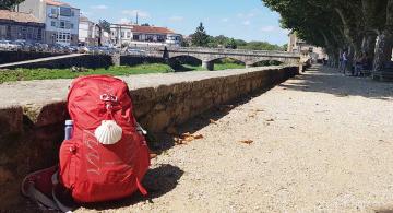 backpack by bridge on Portuguese Camino