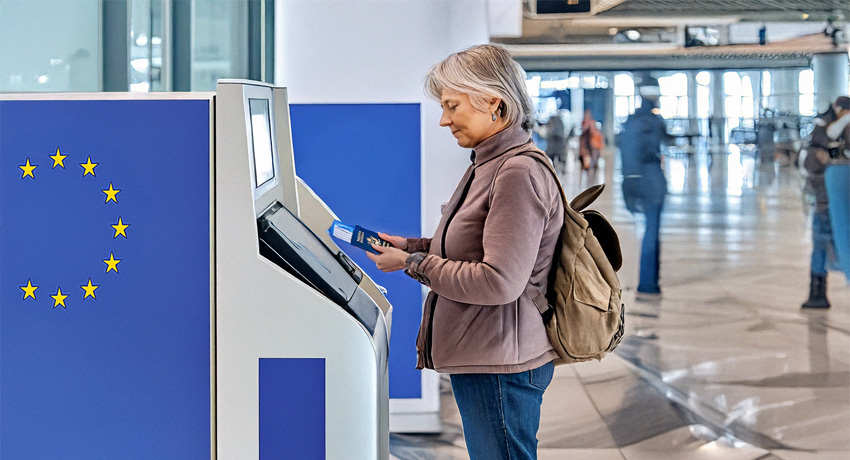 traveler at an airport kiosk
