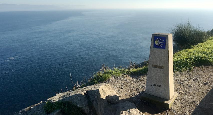 Camino marker by the sea in Finisterre