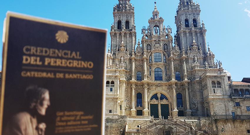 Santiago's Cathedral and pilgrim passport on the foreground