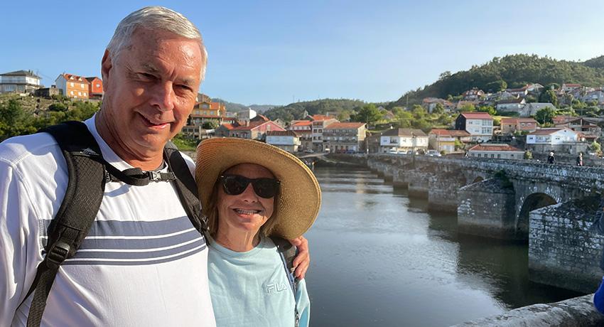 pilgrims with bridge in background