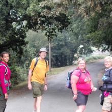 pilgrim group facing the camera on a hike the way tour on el Camino de Santiago