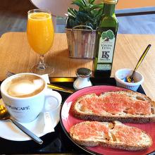 tray with coffee, pan con tomate and orange juice