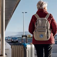 pilgrim waiting outside airport