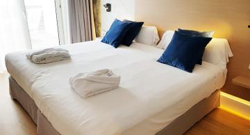 hotel room interior with two beds along the Camino de Santiago