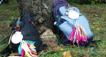 two backpacks with pilgrim shells along the Camino de Santiago trail