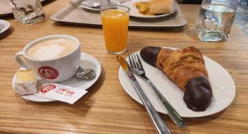 breakfast croissant, coffee and orange juice
